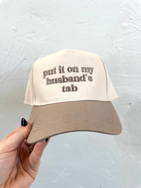Put It On My Husbands Tab Trucker Hat